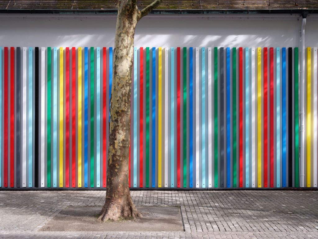 A blurred gradient from pink to purple serves as the background for white text.